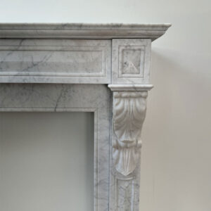Original Louis XVI Mantel in Carrara Marble with Acanthus Leaf Corbels, In-sized Panels and Brass Side Vents