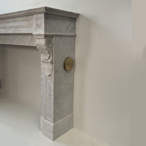 Original Louis XVI Mantel in Carrara Marble with Acanthus Leaf Corbels, In-sized Panels and Brass Side Vents